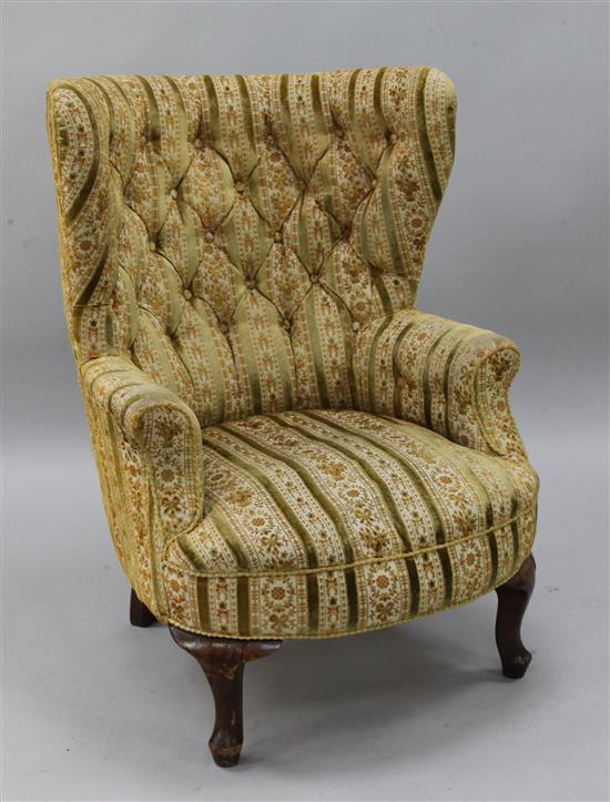 A George I style tub shaped buttoned armchair,